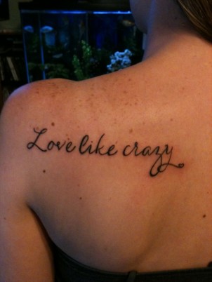 “Love like crazy” quote tattoo on girls shoulder