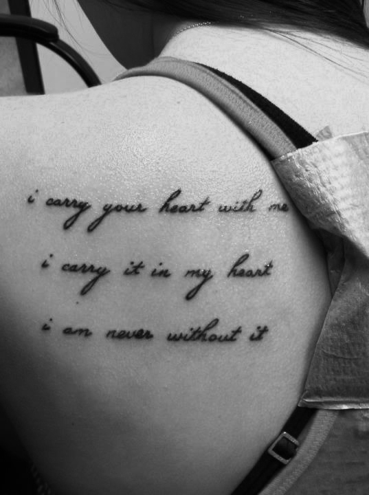 "I carry your heart..." quote tattoo on the back of girls shoulder
