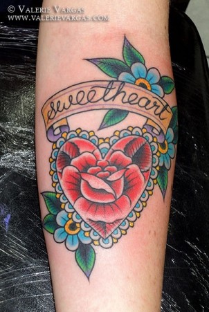 Heart and flowers arm tattoo with “sweatheart” banner