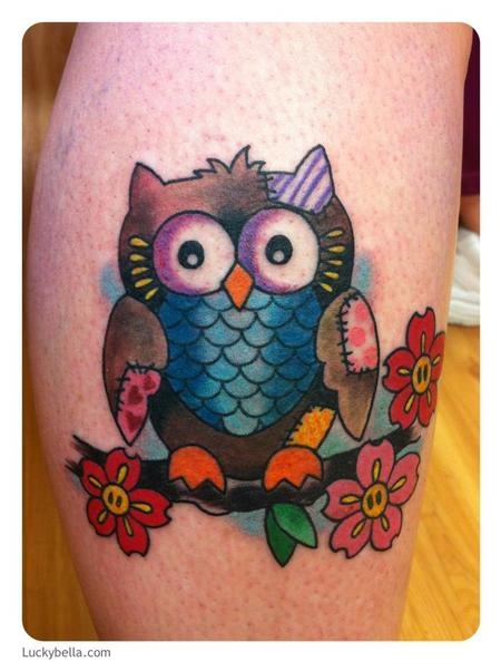 Colorful cartoon patched owl leg tattoo