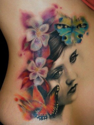 Traditional portrait tattoo with colorful butterflies and flowers
