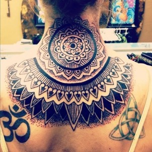 huge tribal design on back of girls neck