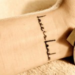 love is louder wrist tattoo