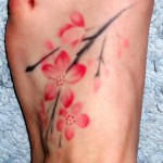 small cherry blossom foot tattoo