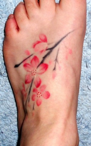 small cherry blossom foot tattoo