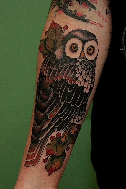 Cute detailed owl tattoo on girls arm