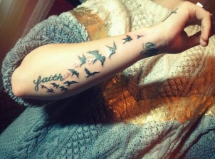 Demi Lovato’s floack of birds tattoo on her arm