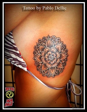 big lotus flower tattoo on girls side