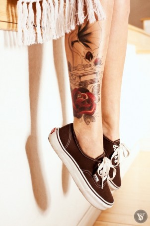 old school record player and rose tattoo