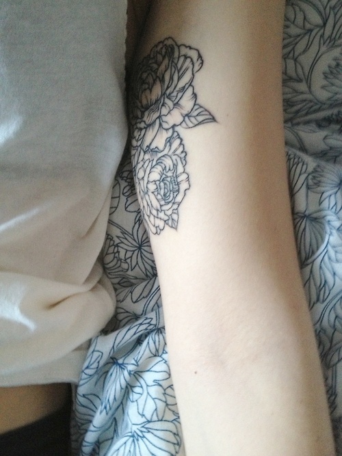 black peony flowers tattoo on girls arm