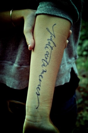 fideli certa quote tattoo on girls arm