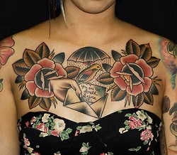 Flower chest tattoos with all kinds of coll stuff going on