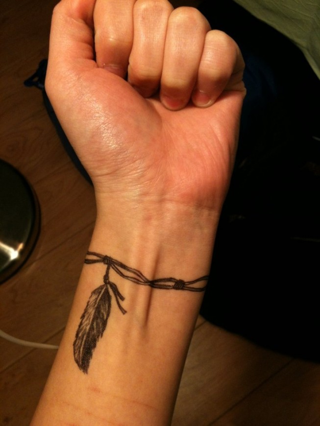 Feather charm bracelet wrist tattoo in black