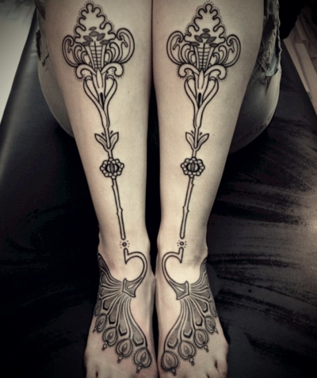 Old school floral patterns tattoo on girls legs