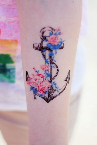 beautiful anchor tattoo with flowers on girls arm