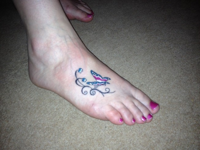 Small Butterfly tatto on girls foot