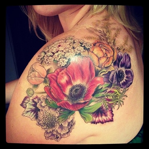 Floral scene shoulder tattoo for girls