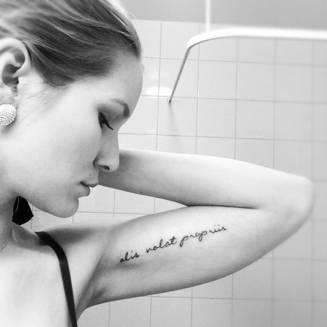 “alis volat propriis” – “she flies with her own wings” quote tattoo