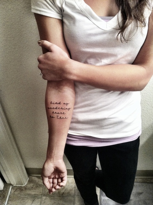 “bind my wandering heart to thee” quote tattoo on girls arm