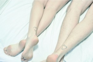 Couples matching heart ankle tattoos